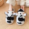 black color cow bedroom slippers on feet