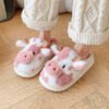 pink color cow bedroom slipper on feet